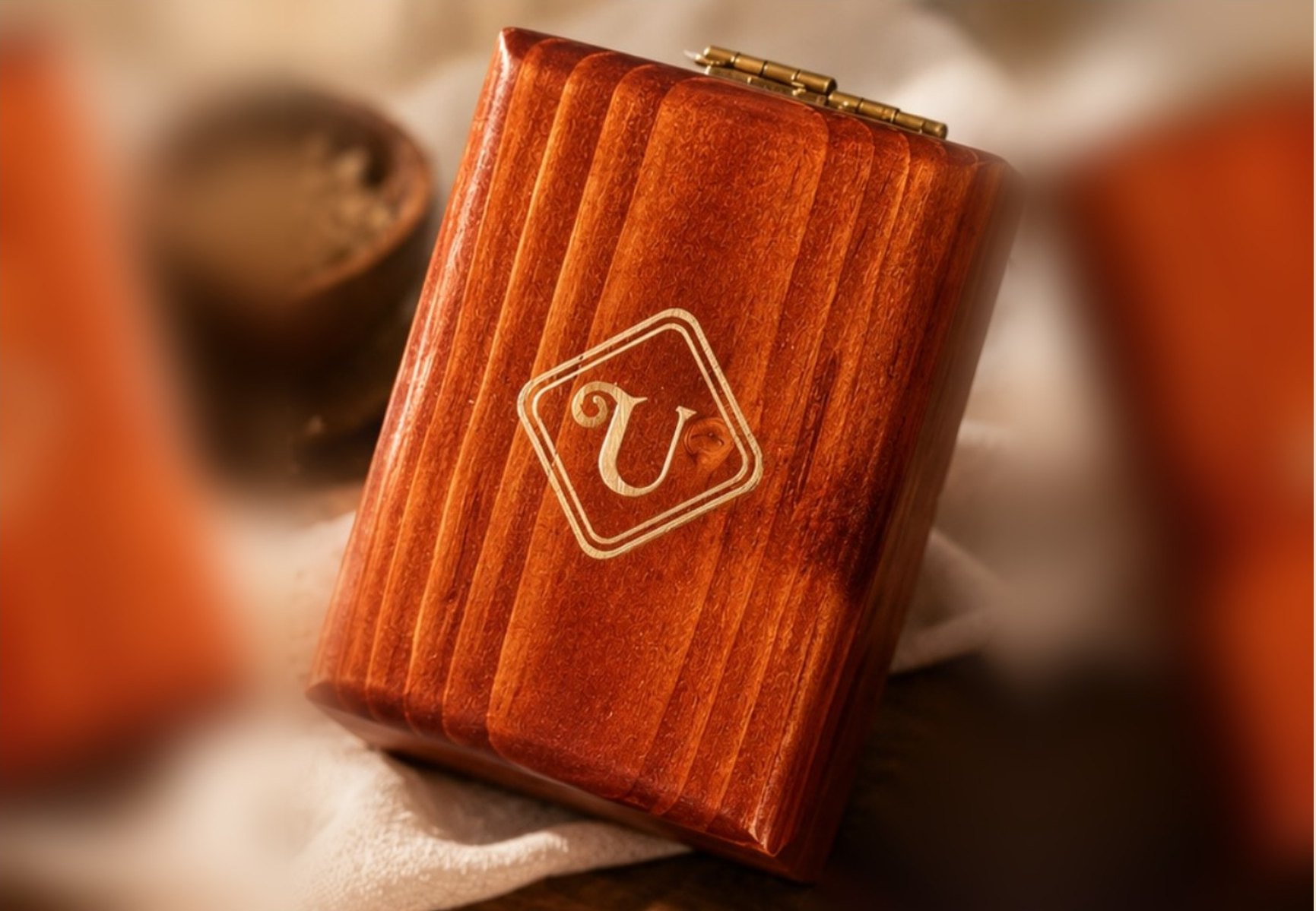The closed Channapatna lacquerware box with the gold Udupi Sugandha emblem on its lid